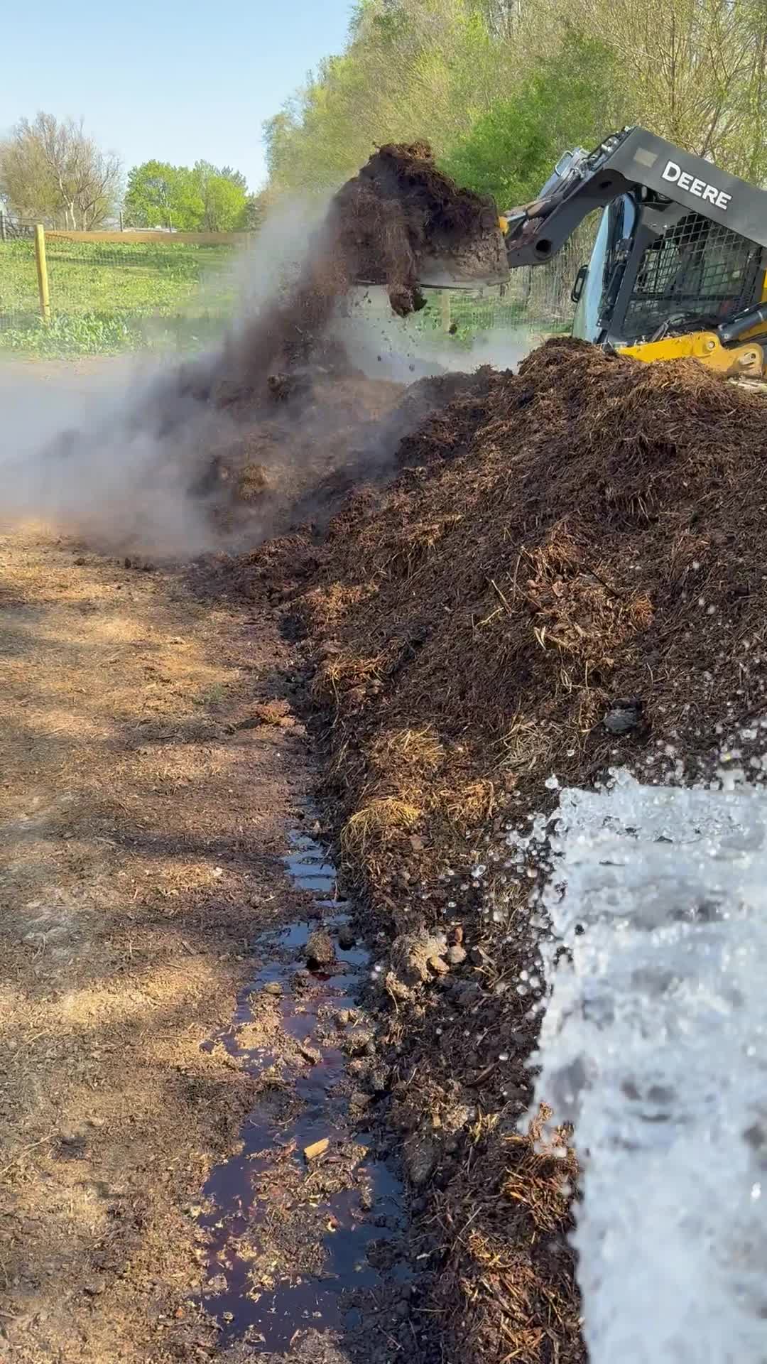 Turning compost during Soily preparation